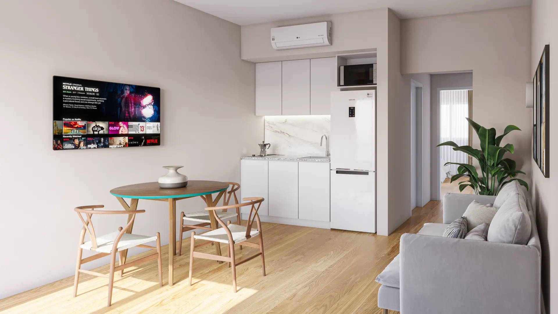 Interior moderno de una suite completamente equipada en Wenelen Suites, con cocina integrada, comedor, aire acondicionado y espacio de estar, ideal para estancias prolongadas en Vaca Muerta.